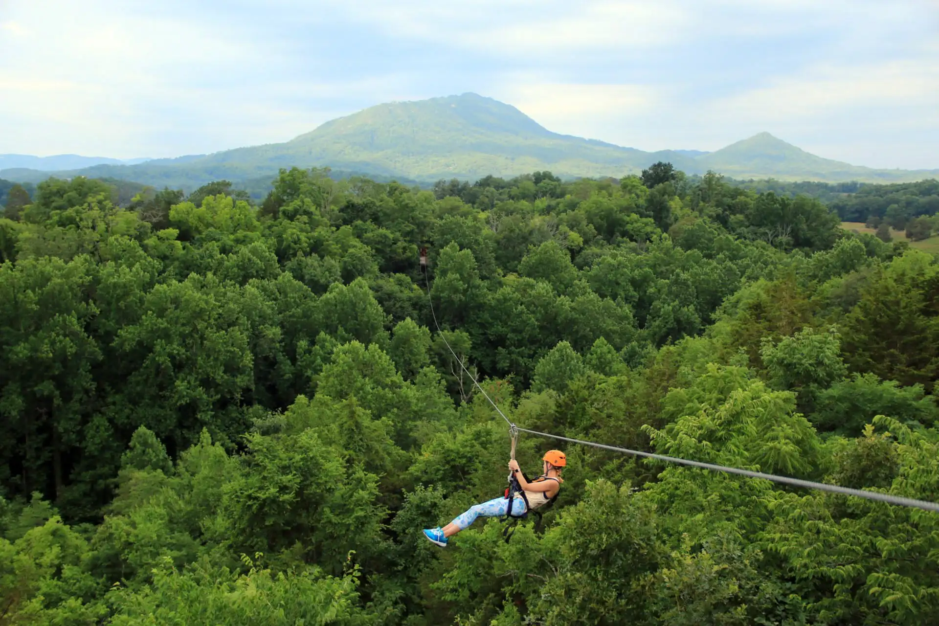 Guest enjoying a family-friendly Smoky Mountain zipline adventure near Pigeon Forge and Gatlinburg